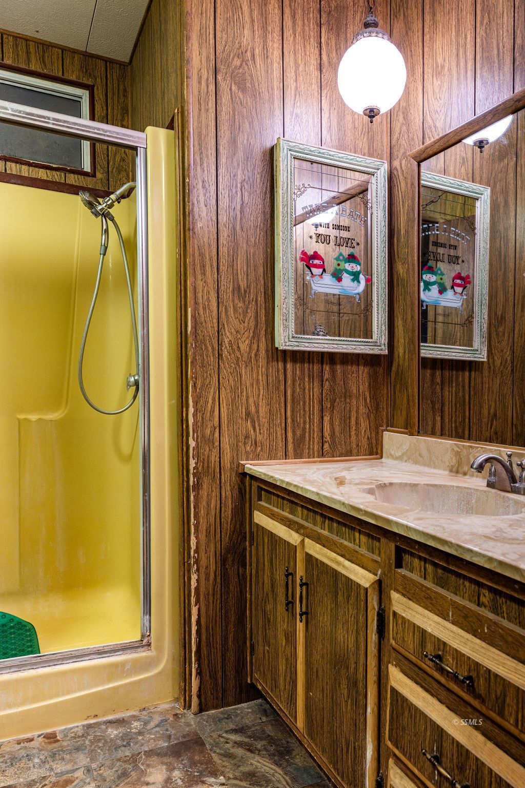 5234 Cholla Way Ridgecrest, CA 93555 - Photo 24 of 39 a bathroom with a sink a mirror and a shower
