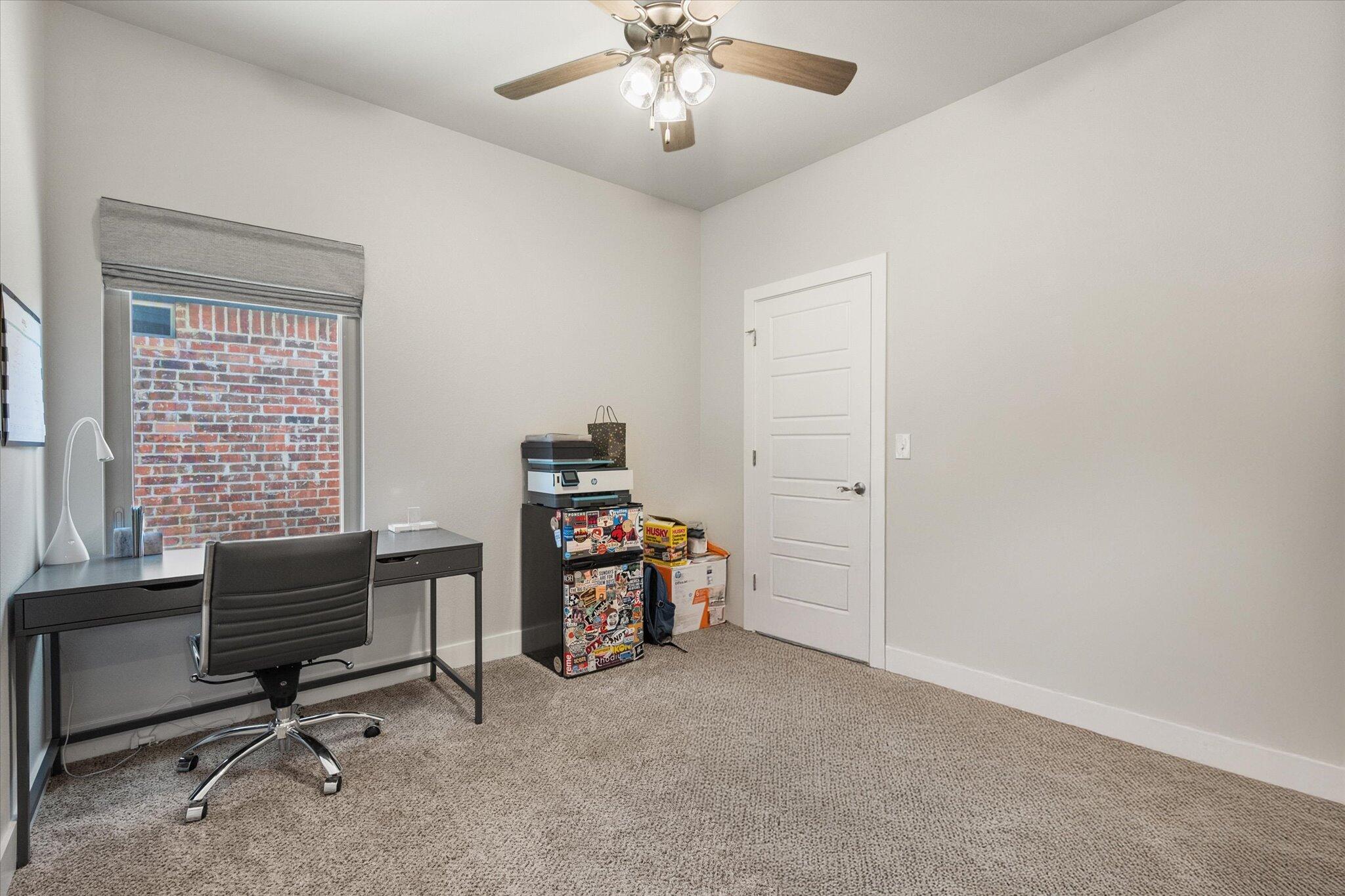 5908 Grinnell Street Lubbock, TX 79416 - Photo 19 of 27 a view of a workspace with furniture