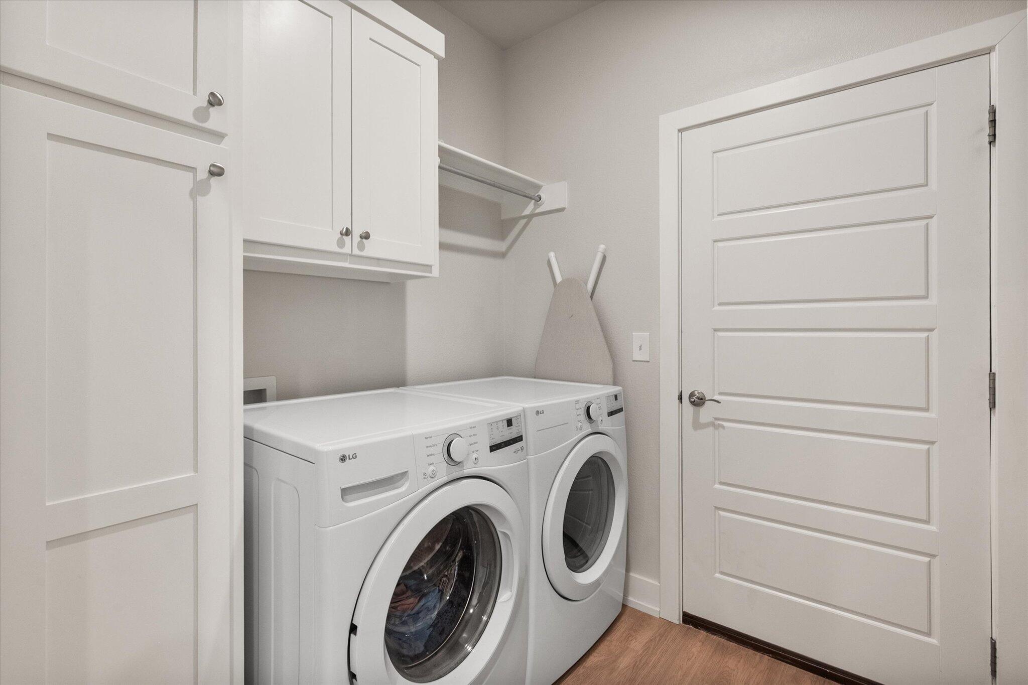 5908 Grinnell Street Lubbock, TX 79416 - Photo 20 of 27 a view of storage and utility room with washer and dryer