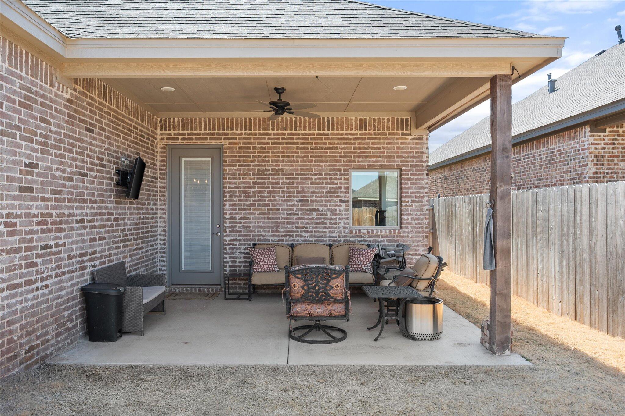 5908 Grinnell Street Lubbock, TX 79416 - Photo 22 of 27 a view of a patio with couple of chairs and potted plants