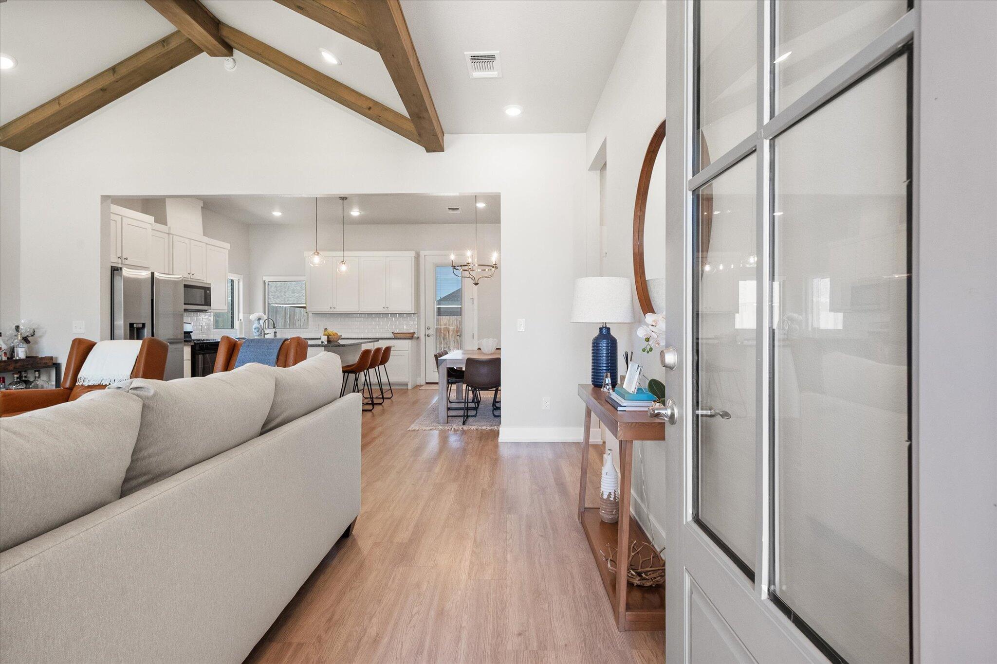 5908 Grinnell Street Lubbock, TX 79416 - Photo 3 of 27 a living room with furniture and a wooden floor