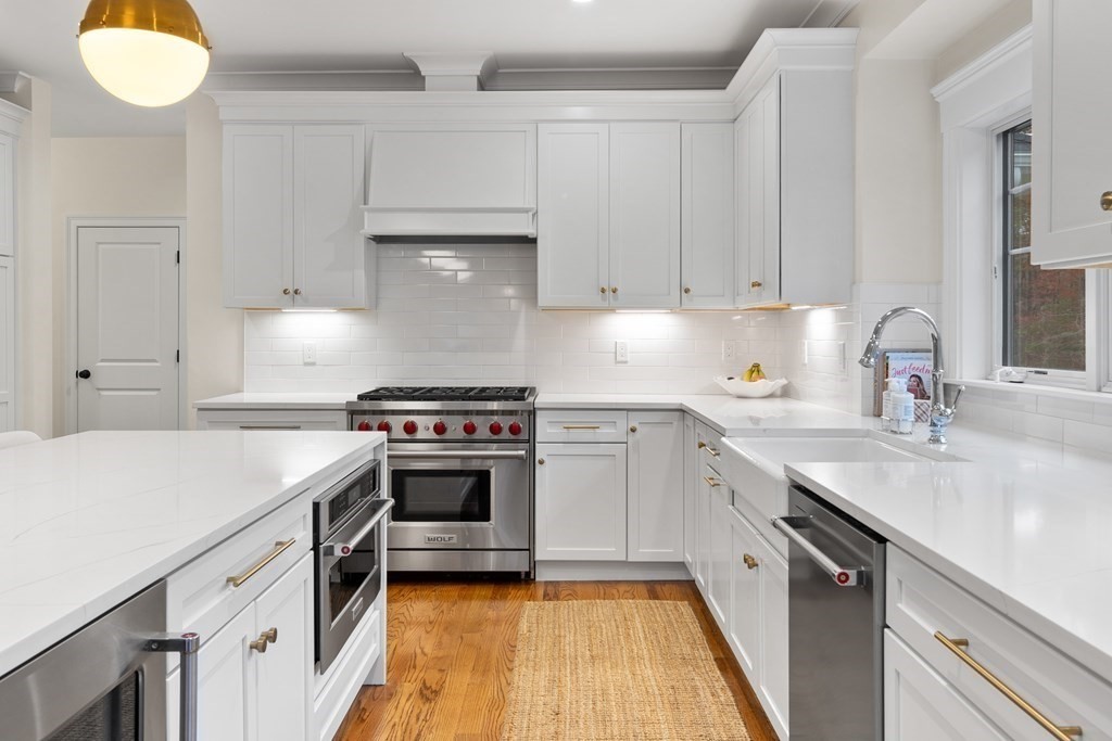 2 Five Paths Wayland, MA 01778 - Photo 11 of 26 a kitchen with a sink a stove and cabinets