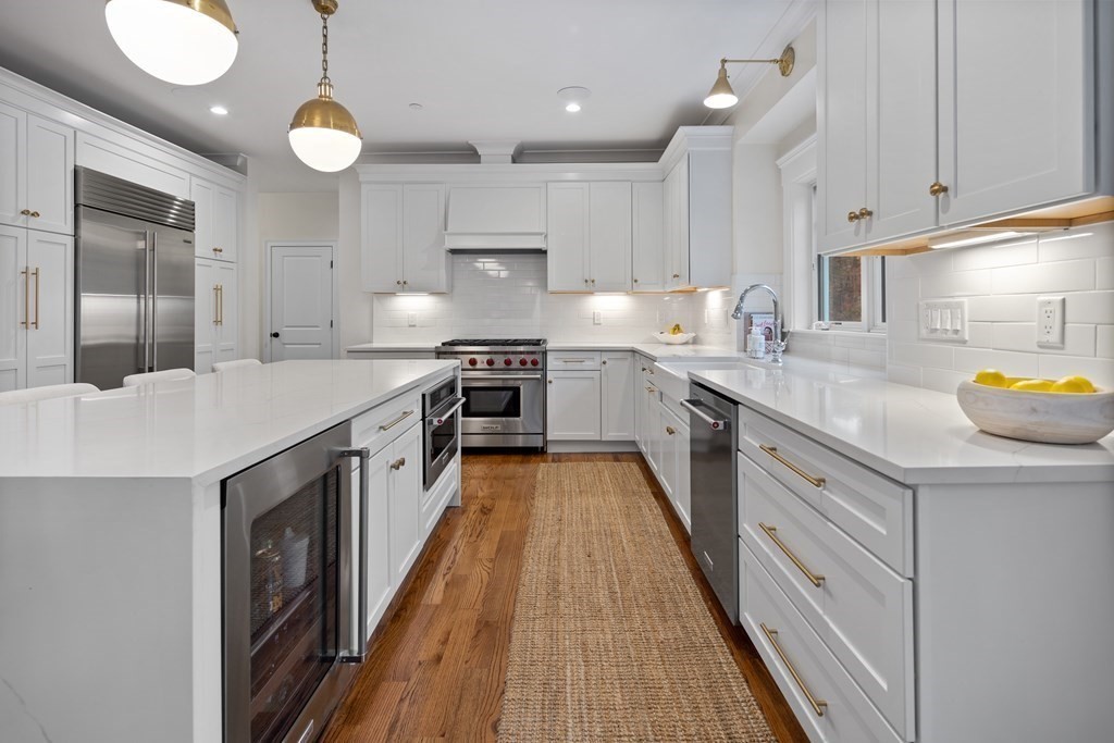 2 Five Paths Wayland, MA 01778 - Photo 13 of 26 a kitchen with stainless steel appliances granite countertop a sink a stove and a refrigerator