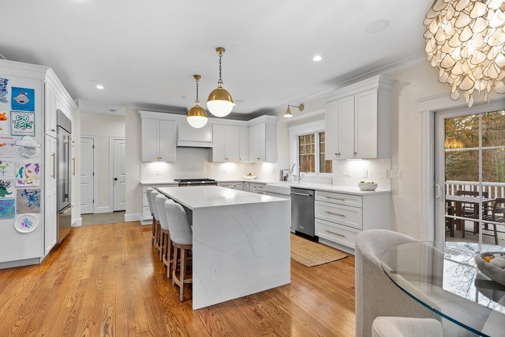 2 Five Paths Wayland, MA 01778 - Photo 14 of 26 a kitchen with kitchen island granite countertop a sink and a stove