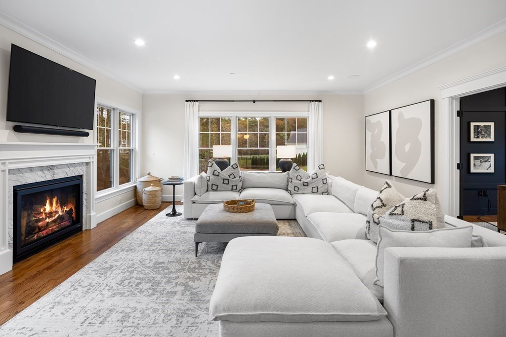 2 Five Paths Wayland, MA 01778 - Photo 2 of 26 a living room with furniture a flat screen tv and a fireplace