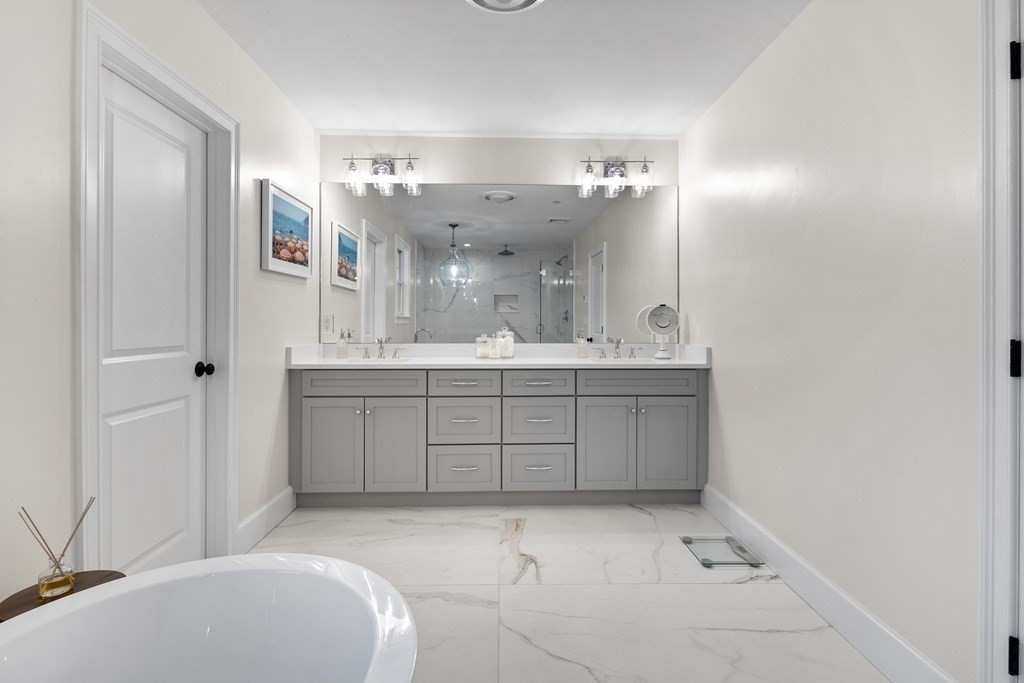 2 Five Paths Wayland, MA 01778 - Photo 23 of 26 a bathroom with a sink a toilet and mirror