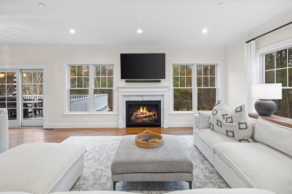 2 Five Paths Wayland, MA 01778 - Photo 3 of 26 a living room with furniture a flat screen tv and a fireplace