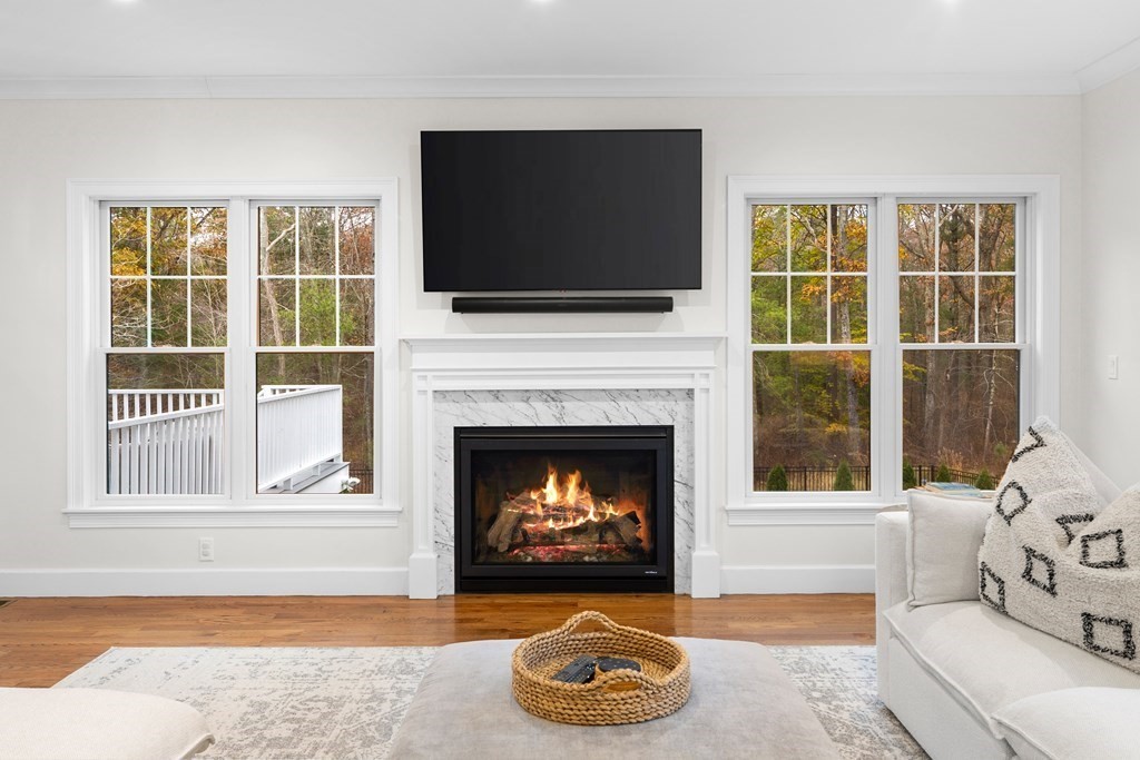 2 Five Paths Wayland, MA 01778 - Photo 5 of 26 a living room with furniture a flat screen tv and a fireplace