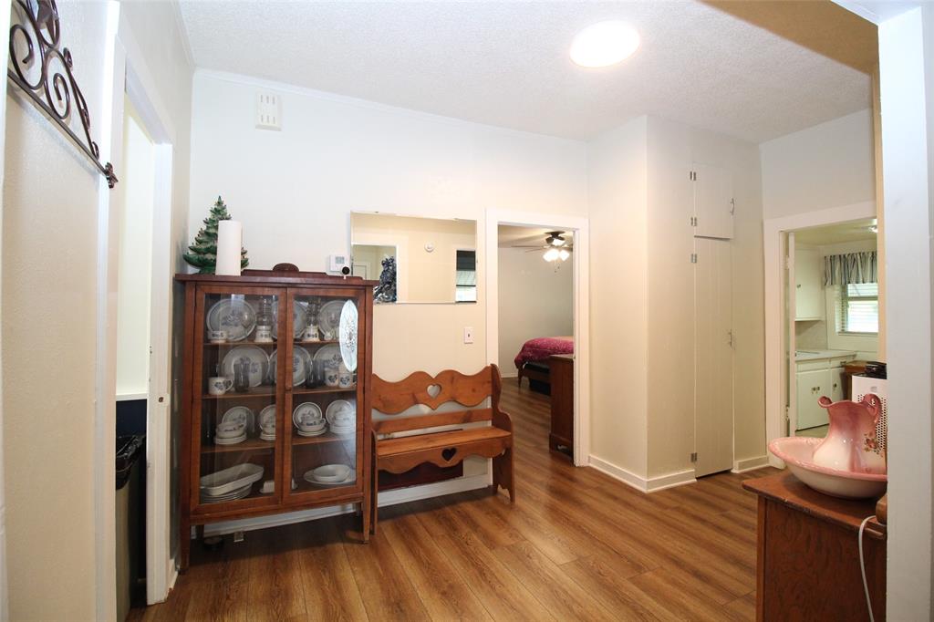 220 North 14th Avenue Munday, TX 76371 - Photo 19 of 34 a living room with furniture and a wooden floor