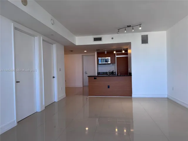 an empty room with a bathroom