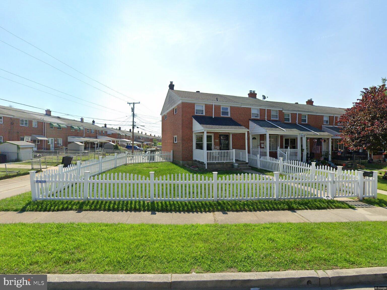 8079 Wallace Road Dundalk, MD 21222 - Photo 1 of 12 a view of a house with a small yard and plants