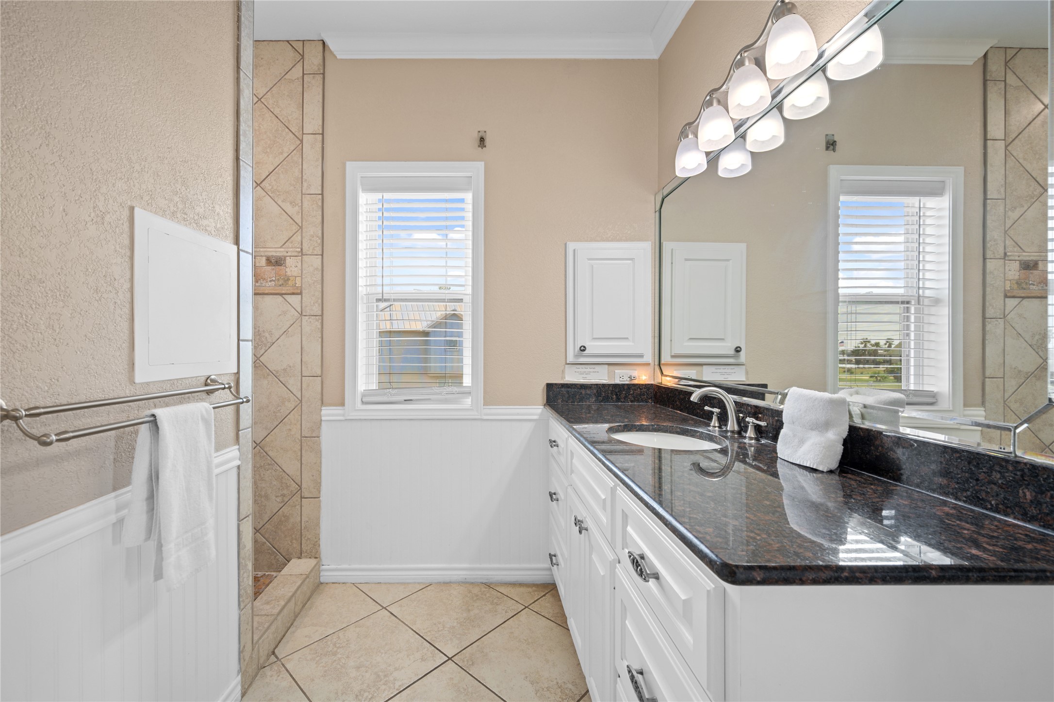 740 Copano Cove Road Rockport, TX 78382 - Photo 24 of 35 a kitchen with a sink stove and cabinets