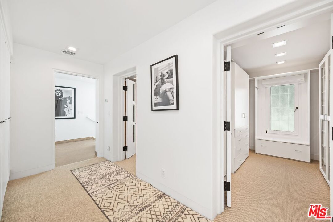 25302 Malibu Road Malibu, CA 90265 - Photo 12 of 36 a view of a hallway with closet and bathroom