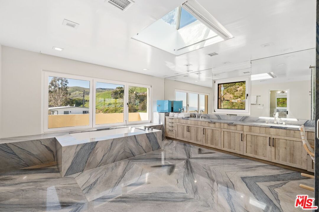 25302 Malibu Road Malibu, CA 90265 - Photo 14 of 36 a living room with furniture and a large window