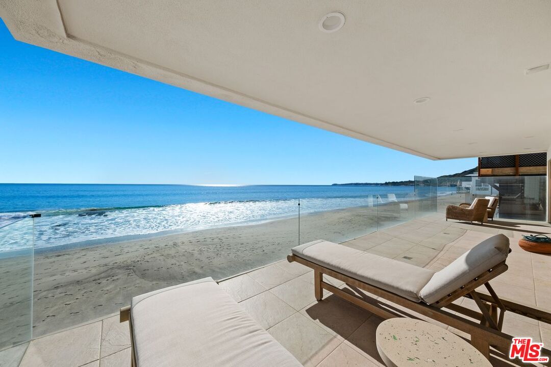 25302 Malibu Road Malibu, CA 90265 - Photo 22 of 36 a living room with a table tennis table and chairs