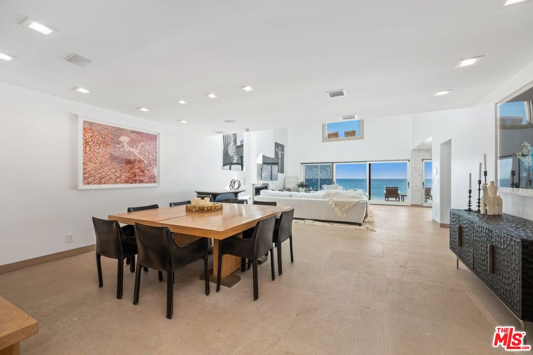 25302 Malibu Road Malibu, CA 90265 - Photo 4 of 36 a living room with stainless steel appliances a table and chairs