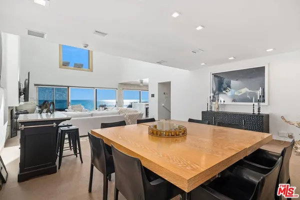 a kitchen with stainless steel appliances cabinets and wooden floor