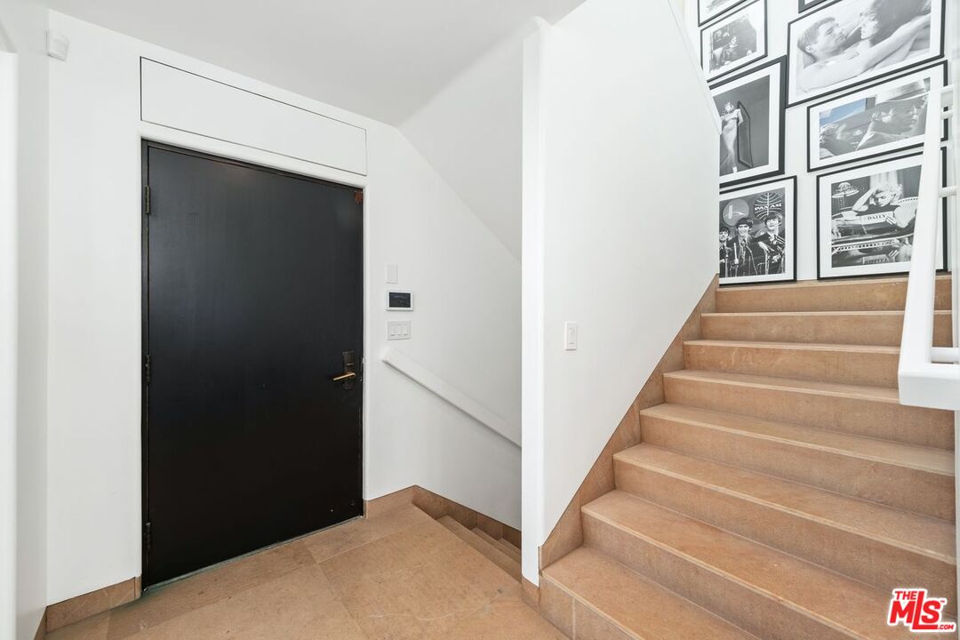25302 Malibu Road Malibu, CA 90265 - Photo 10 of 36 a view of staircase with white walls and windows
