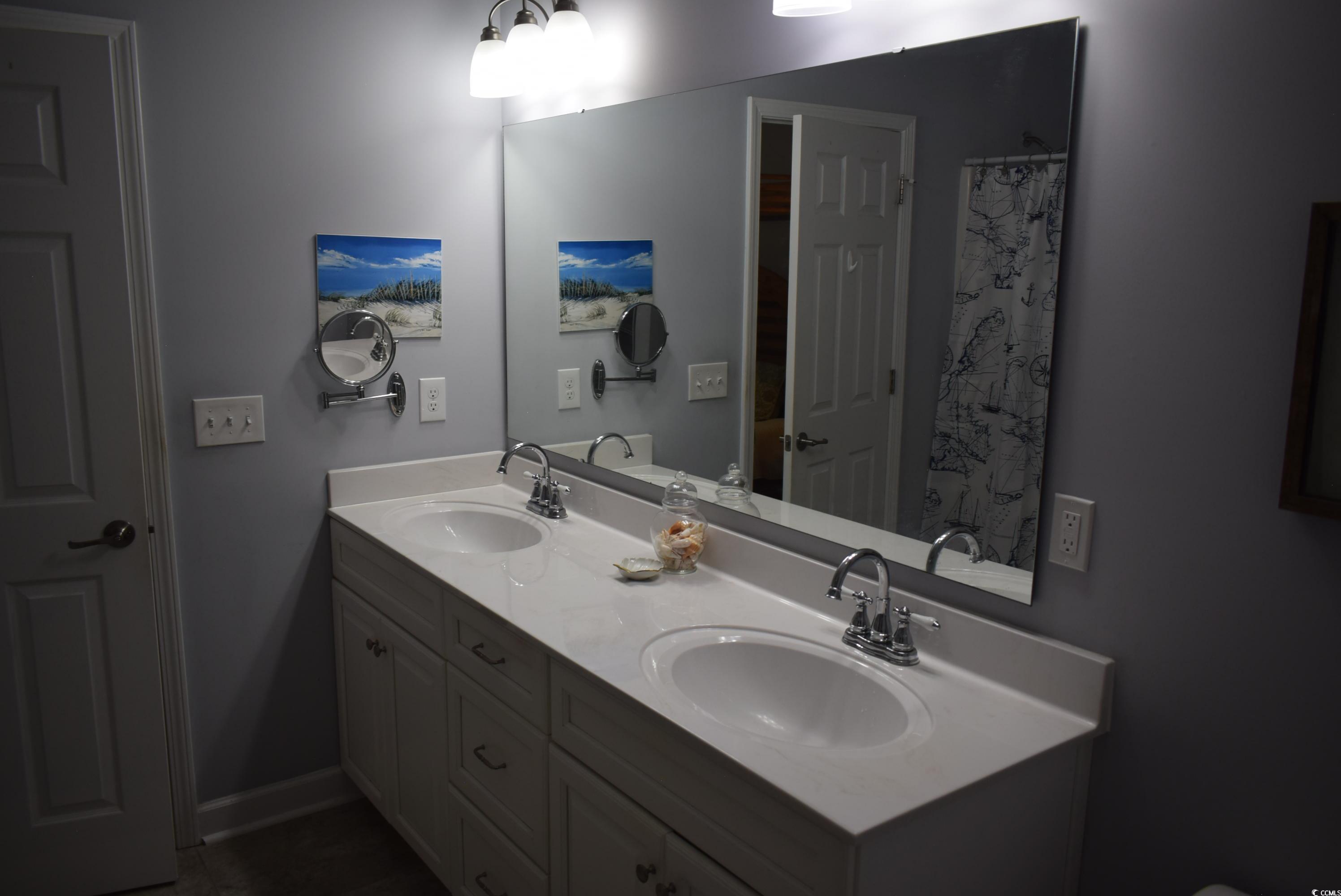 216 Rose Water Loop Myrtle Beach, SC 29588 - Photo 19 of 40 Bathroom with double vanity and baseboards