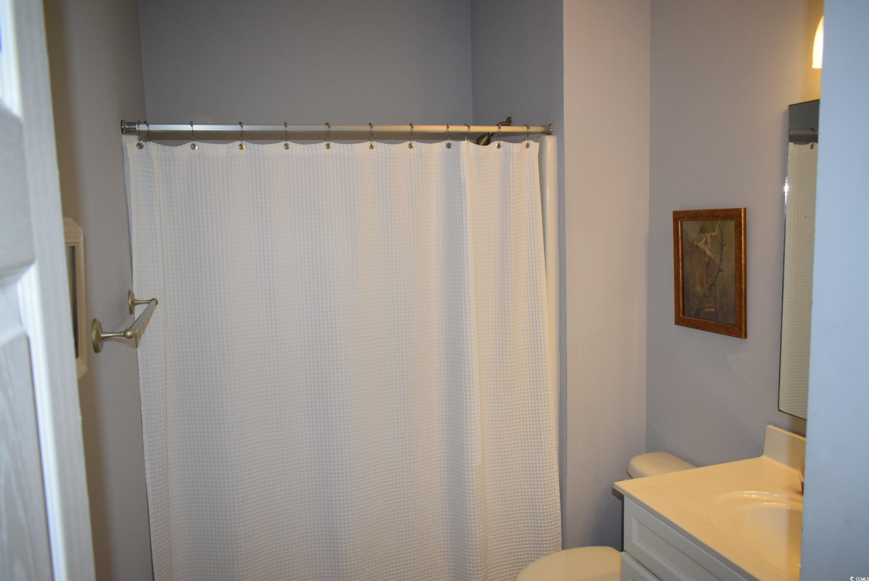 216 Rose Water Loop Myrtle Beach, SC 29588 - Photo 20 of 40 Full bath featuring vanity and curtained shower