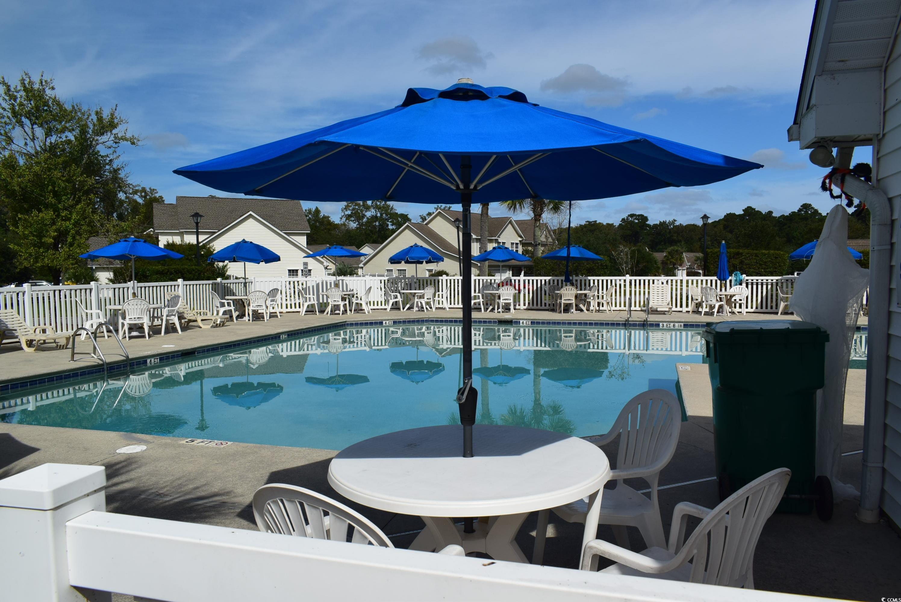 216 Rose Water Loop Myrtle Beach, SC 29588 - Photo 29 of 40 Community pool with a patio