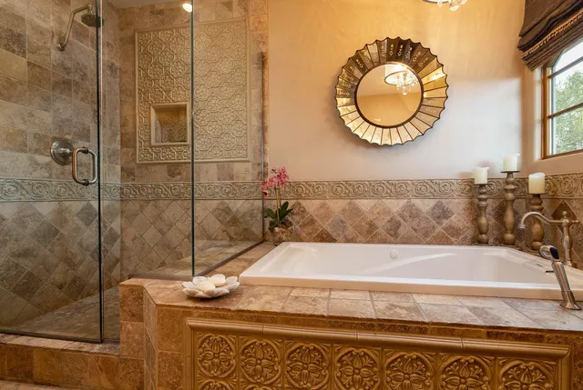 a bathroom with a tub and a shower