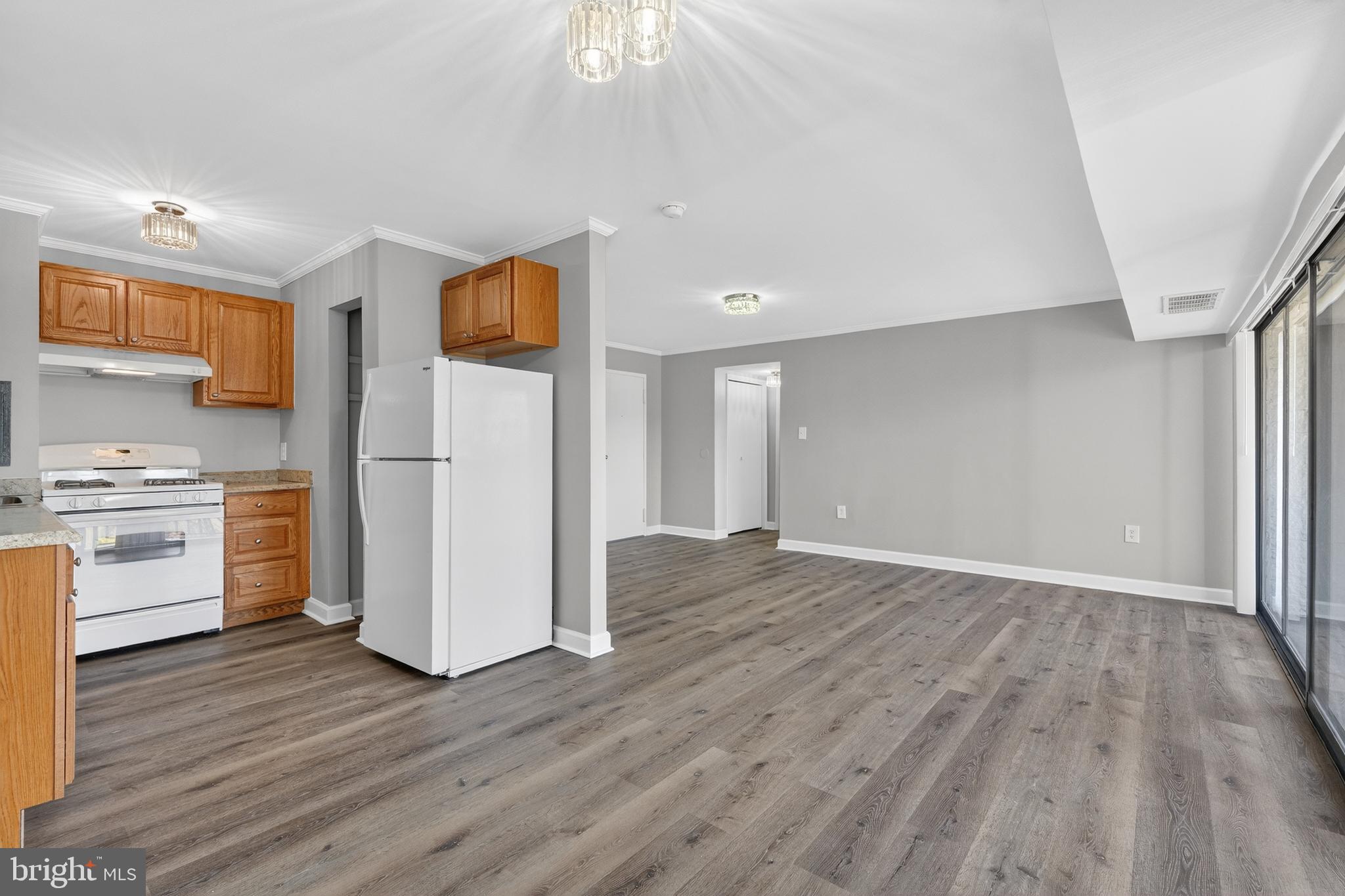 1804 Metzerott Road, Unit 504 Silver Spring, MD 20903 - Photo 12 of 24 a view of a kitchen with wooden floor and electronic appliances