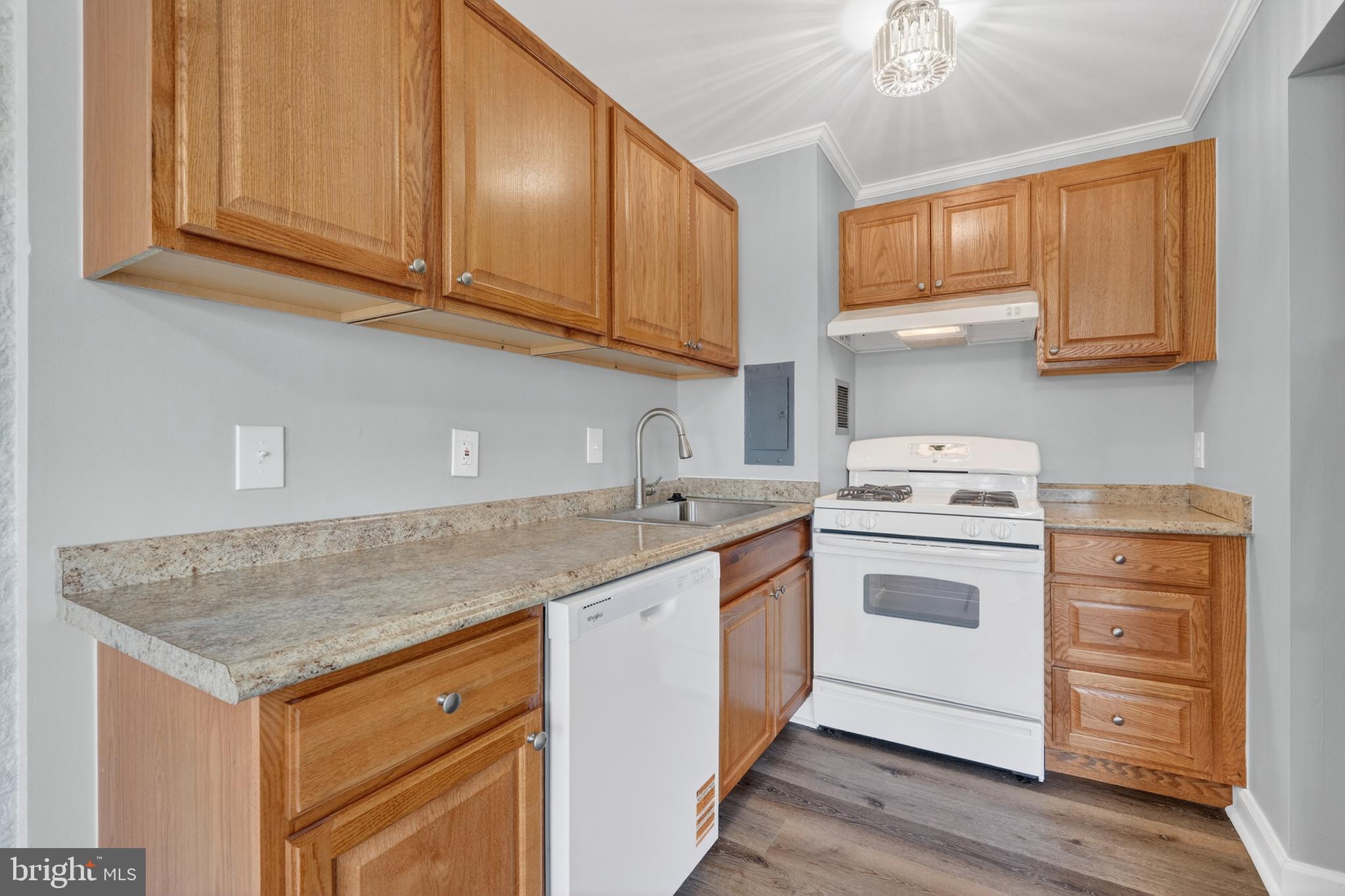 1804 Metzerott Road, Unit 504 Silver Spring, MD 20903 - Photo 14 of 24 a kitchen with stainless steel appliances granite countertop a sink stove and cabinets