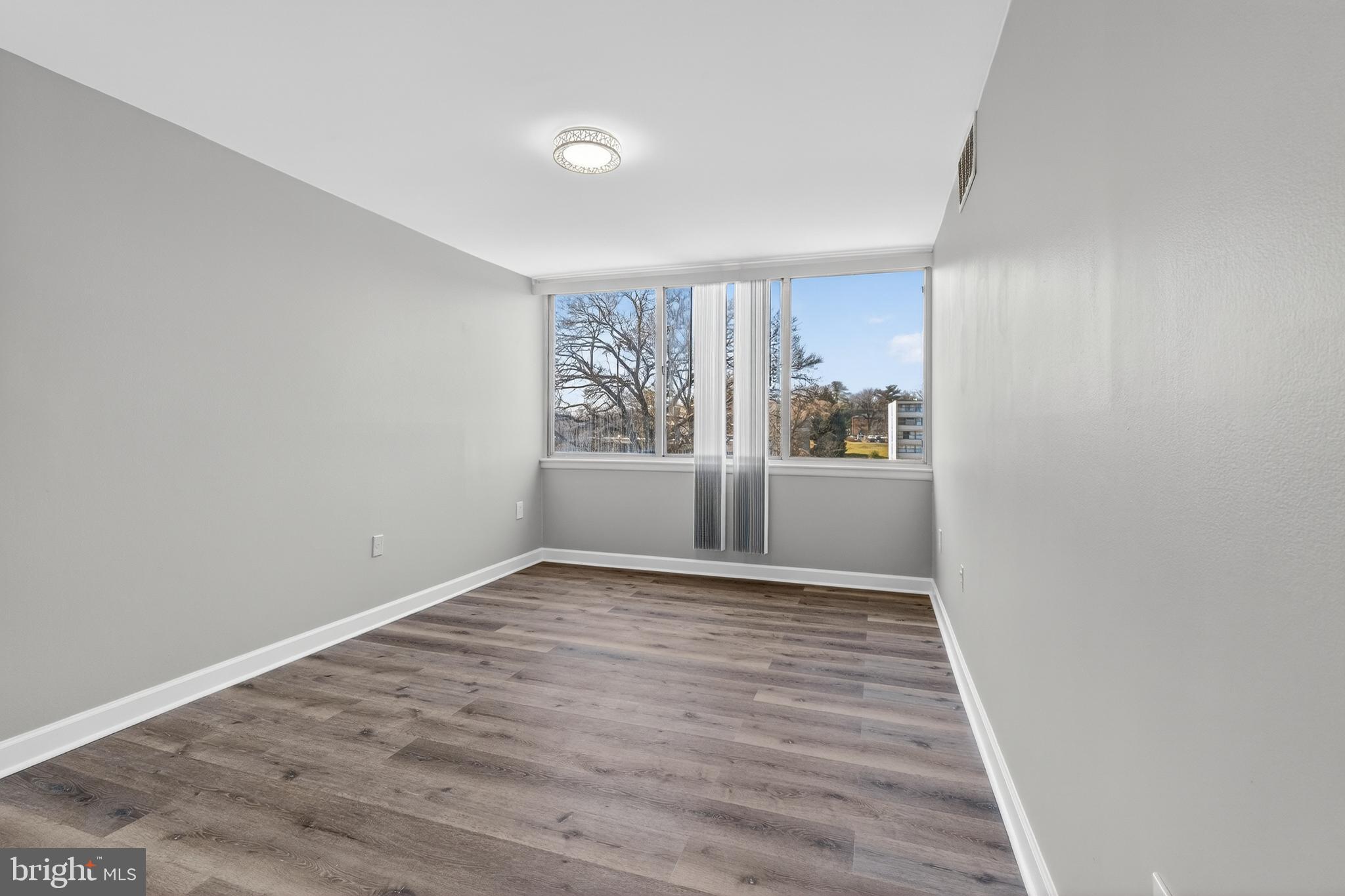 1804 Metzerott Road, Unit 504 Silver Spring, MD 20903 - Photo 22 of 24 a view of an empty room with a window