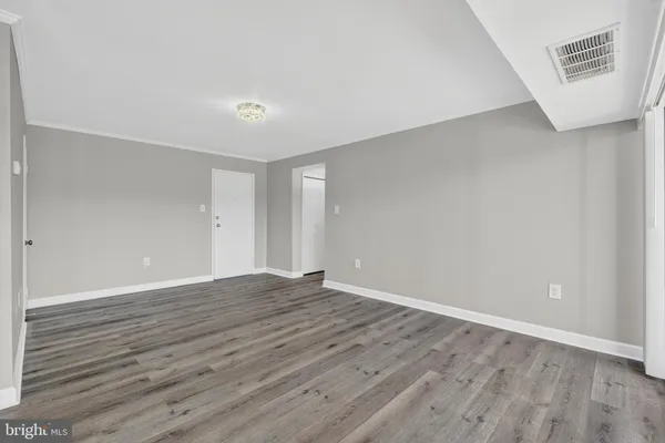 a kitchen with a refrigerator and a stove top oven