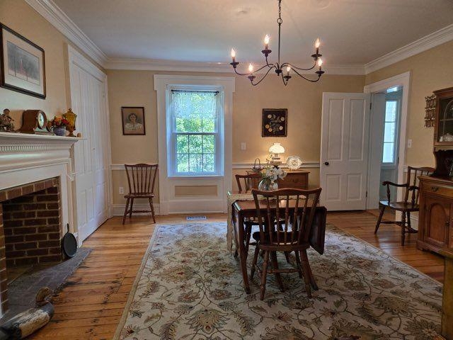 1202 Walkers Creek Road Middlebrook, VA 24459 - Photo 12 of 74 a view of a dining room with furniture window and wooden floor