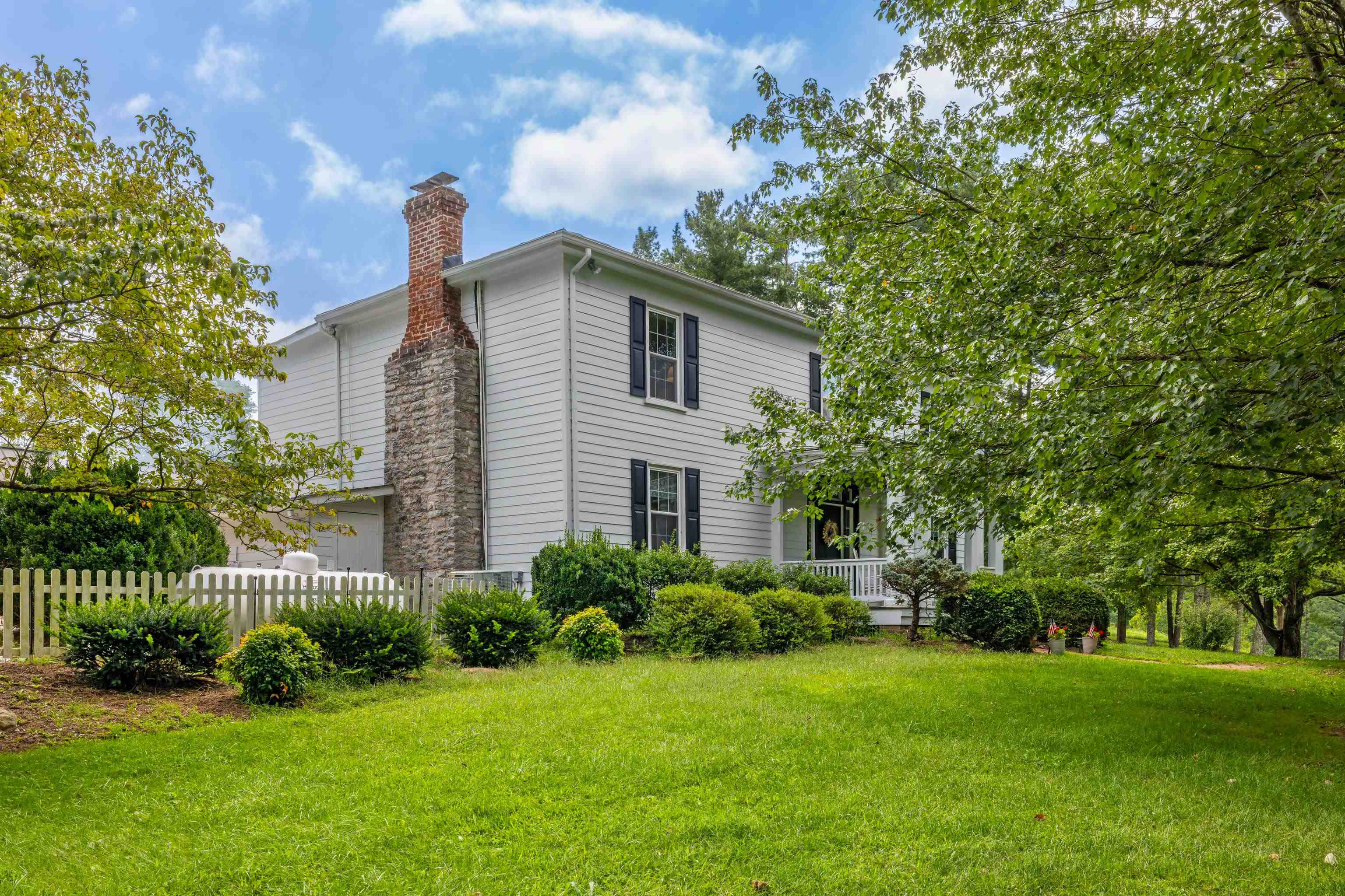 1202 Walkers Creek Road Middlebrook, VA 24459 - Photo 3 of 74 a front view of a house with a yard and trees