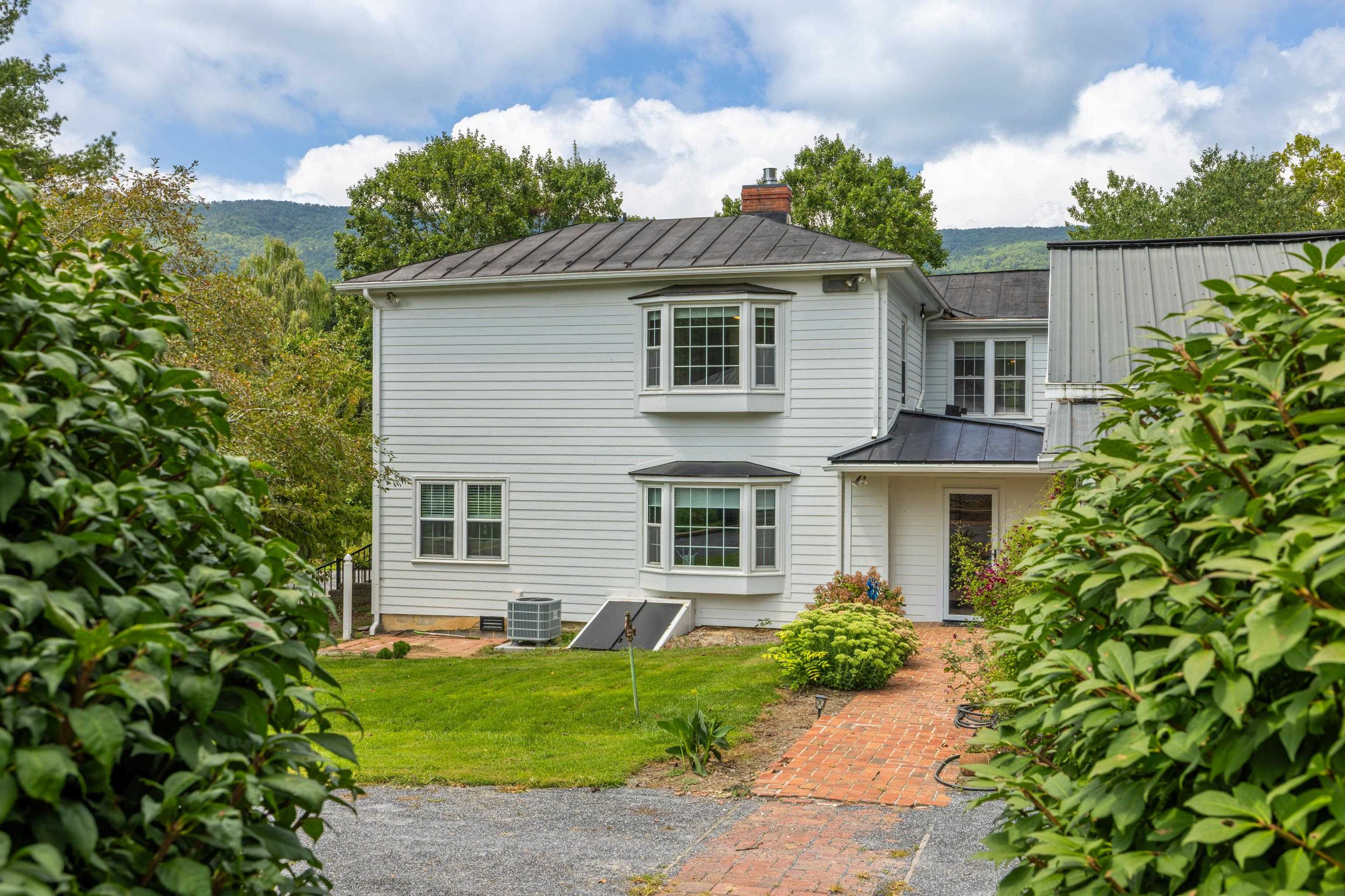 1202 Walkers Creek Road Middlebrook, VA 24459 - Photo 47 of 74 a view of a house with a yard and plants