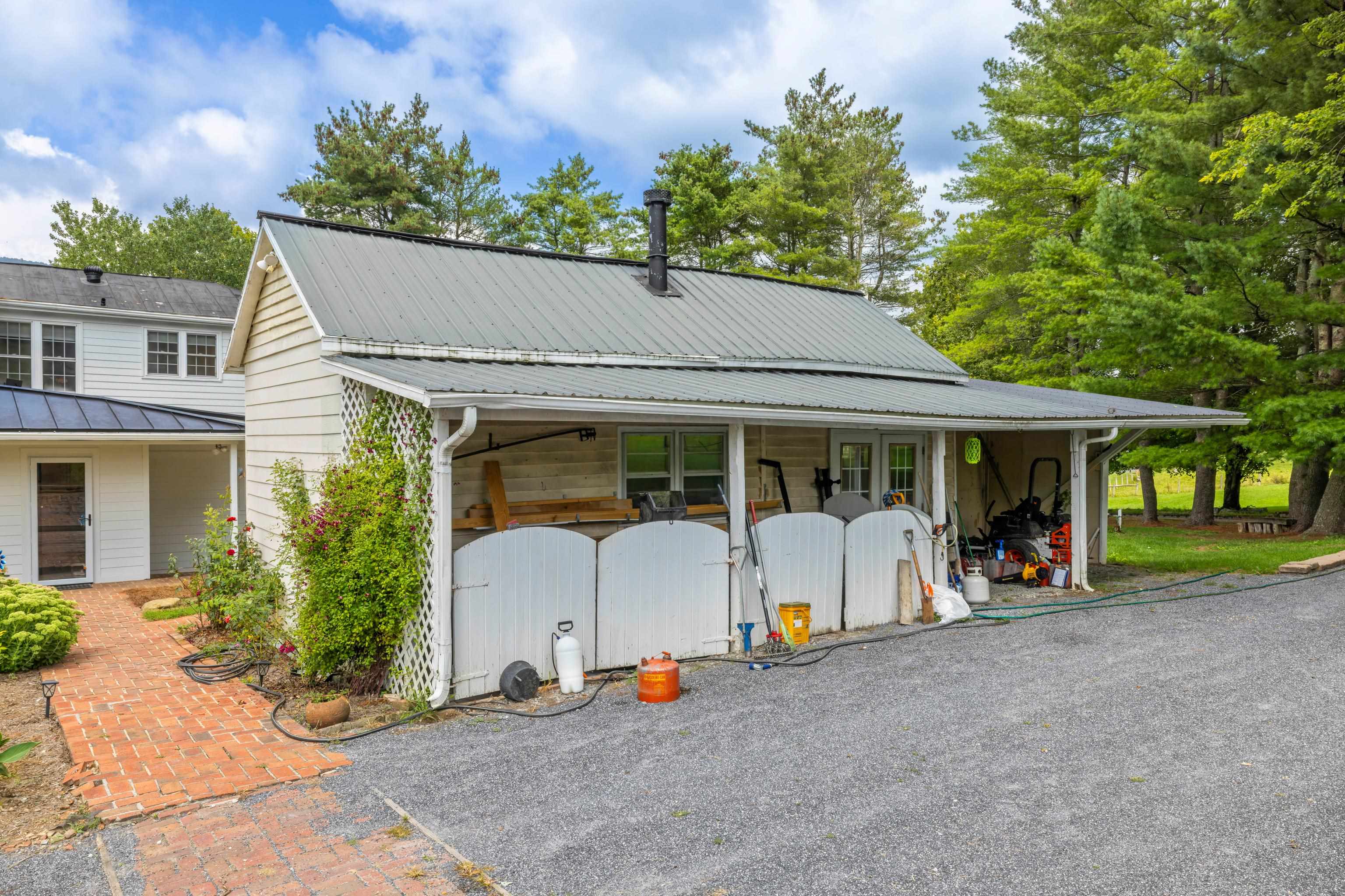 1202 Walkers Creek Road Middlebrook, VA 24459 - Photo 55 of 74 a view of a house with backyard sitting area and garden