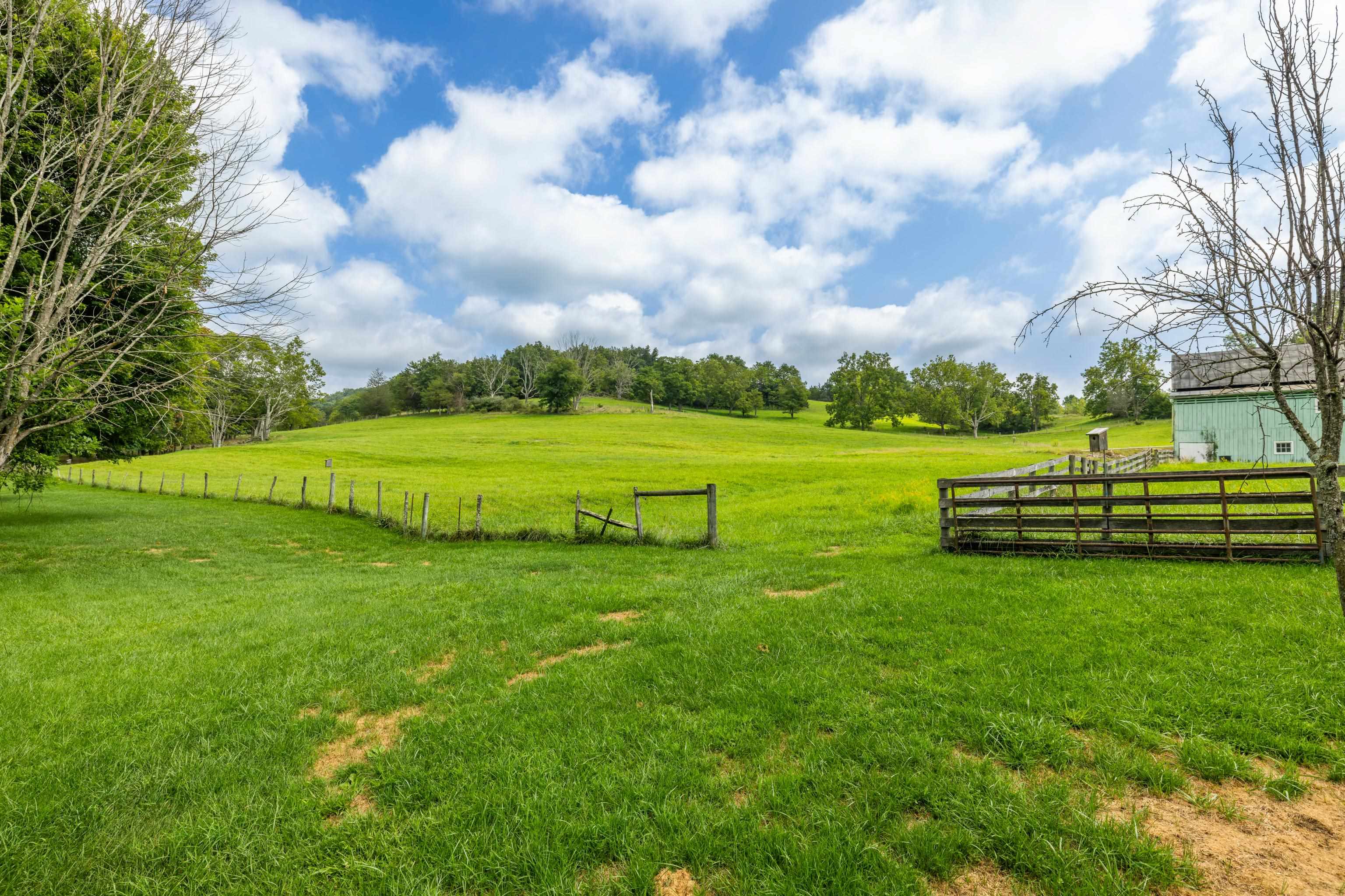 1202 Walkers Creek Road Middlebrook, VA 24459 - Photo 59 of 74 a view of a golf course with a lake