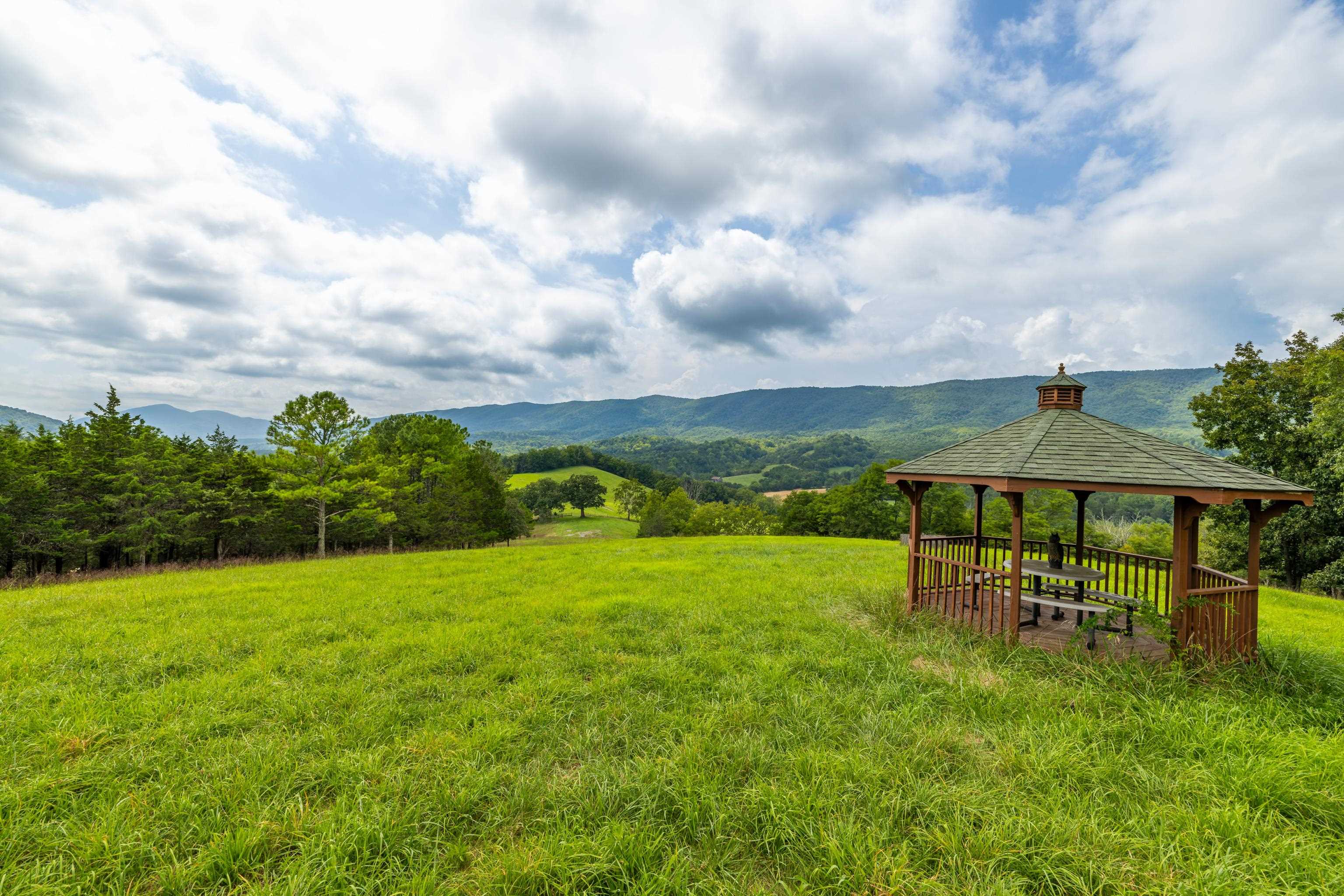 1202 Walkers Creek Road Middlebrook, VA 24459 - Photo 65 of 74 a view of a garden with a table and chairs
