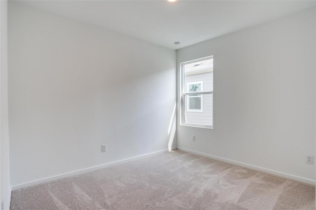 4237 Haflinger Road Providence Village, TX 76227 - Photo 12 of 14 a view of an empty room with a window