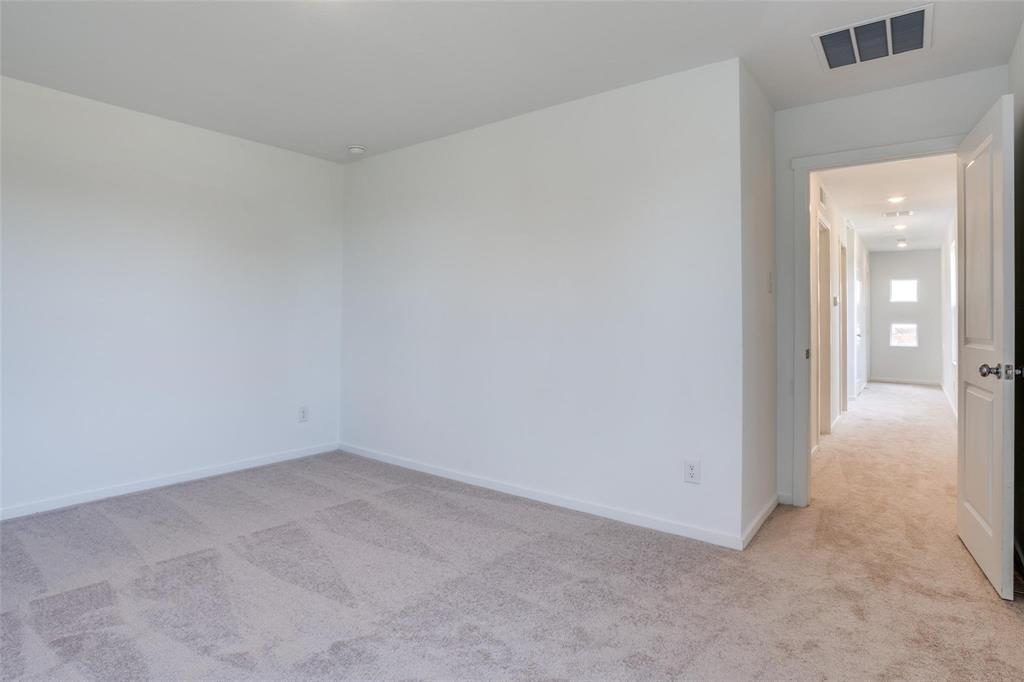 4237 Haflinger Road Providence Village, TX 76227 - Photo 7 of 14 an empty room with an entryway
