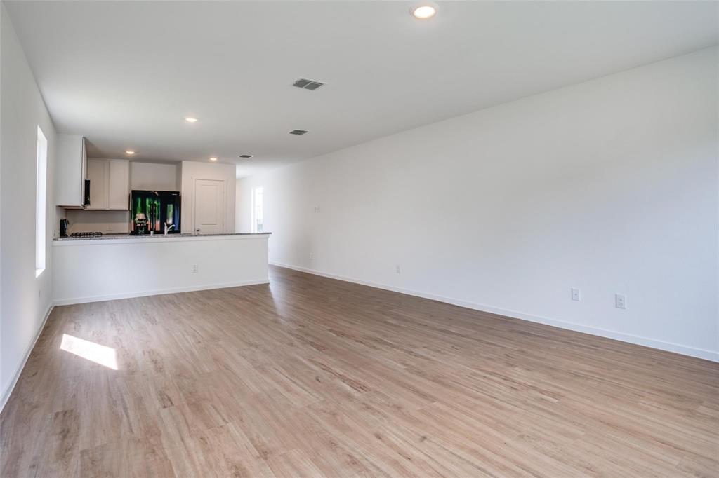 4237 Haflinger Road Providence Village, TX 76227 - Photo 9 of 14 a view of a kitchen with a sink and a window