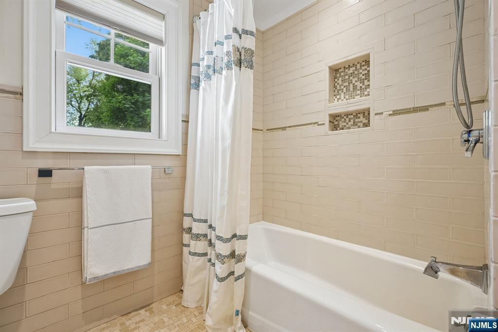 11 Mt Vernon Road Montclair, NJ 07043 - Photo 32 of 49 a bathroom with a bathtub and shower