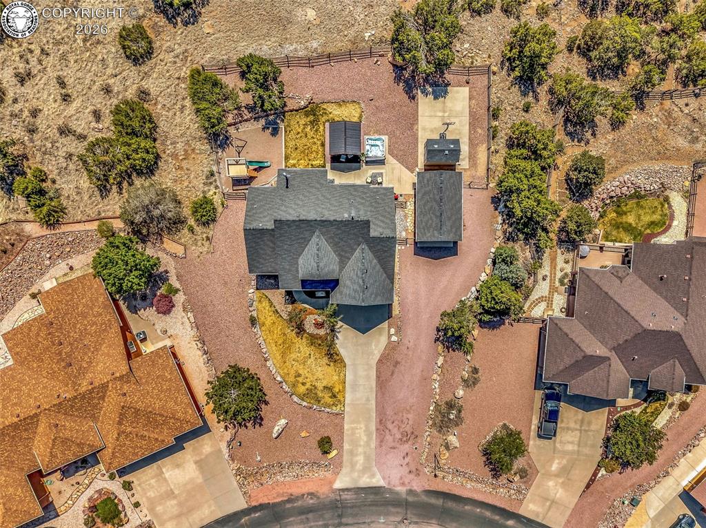 182 Raptor Court Canon City, CO 81212 - Photo 45 of 50 What truly sets this property apart is the exceptional outdoor setting and expanded usable space behind the home. Beyond the fully fenced backyard and walking path, there is a significant portion of land that is still within the property boundaries?offering space to explore, relax, or create additional outdoor enhancements.