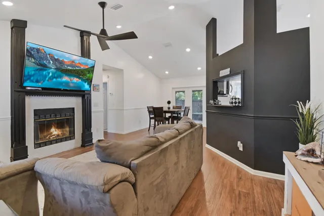 a living room with furniture and a fireplace