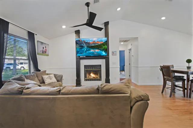 a living room with furniture and a fireplace