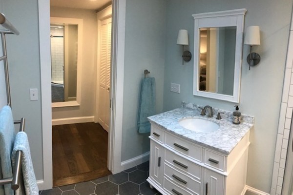 685 Pond Street, Unit B Franklin, MA 02038 - Photo 11 of 11 a bathroom with a sink and a mirror
