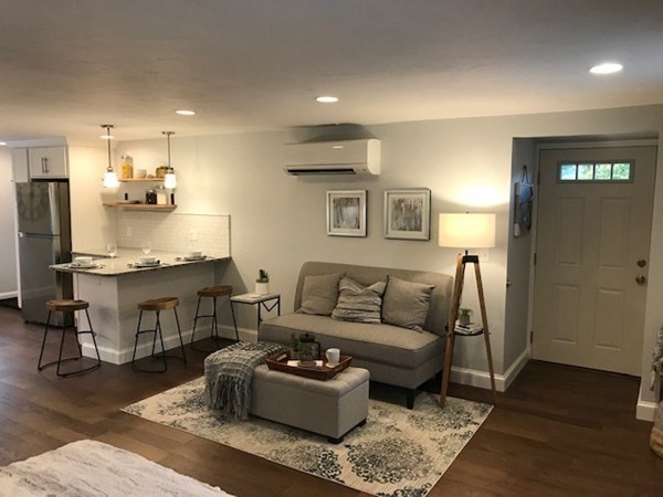 685 Pond Street, Unit B Franklin, MA 02038 - Photo 2 of 11 a living room with furniture and kitchen view