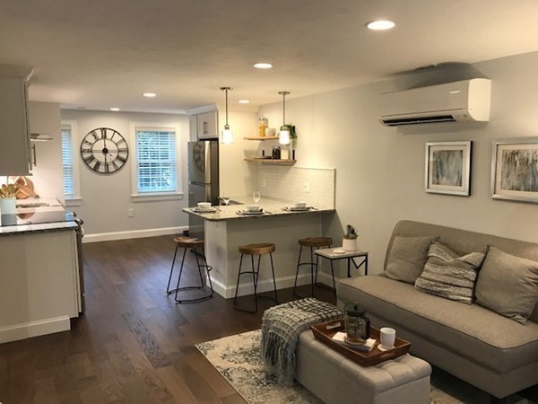 685 Pond Street, Unit B Franklin, MA 02038 - Photo 7 of 11 a living room with furniture and kitchen view