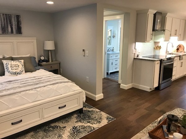 685 Pond Street, Unit B Franklin, MA 02038 - Photo 9 of 11 a large white bed in a white room