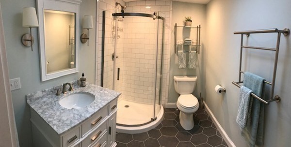 685 Pond Street, Unit B Franklin, MA 02038 - Photo 10 of 11 a bathroom with a granite countertop sink toilet and shower