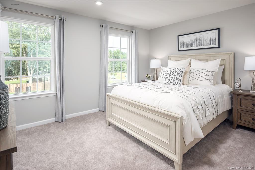 7108 Messina Road, Unit 137 Indian Land, SC 29707 - Photo 10 of 13 a bedroom with a bed and a window