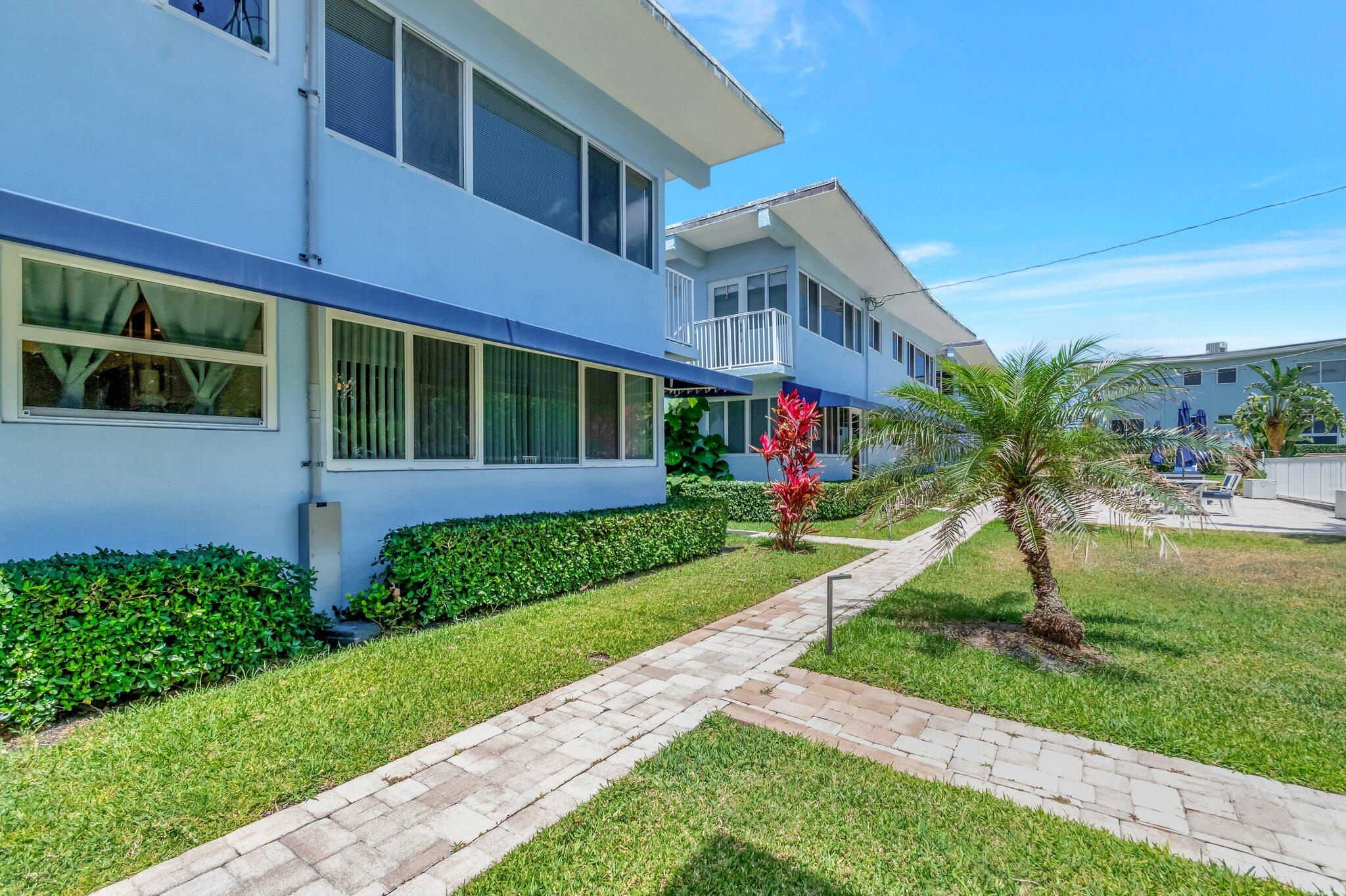 5700 Old Ocean Boulevard, Unit R Ocean Ridge, FL 33435 - Photo 14 of 20 a front view of a house with a garden